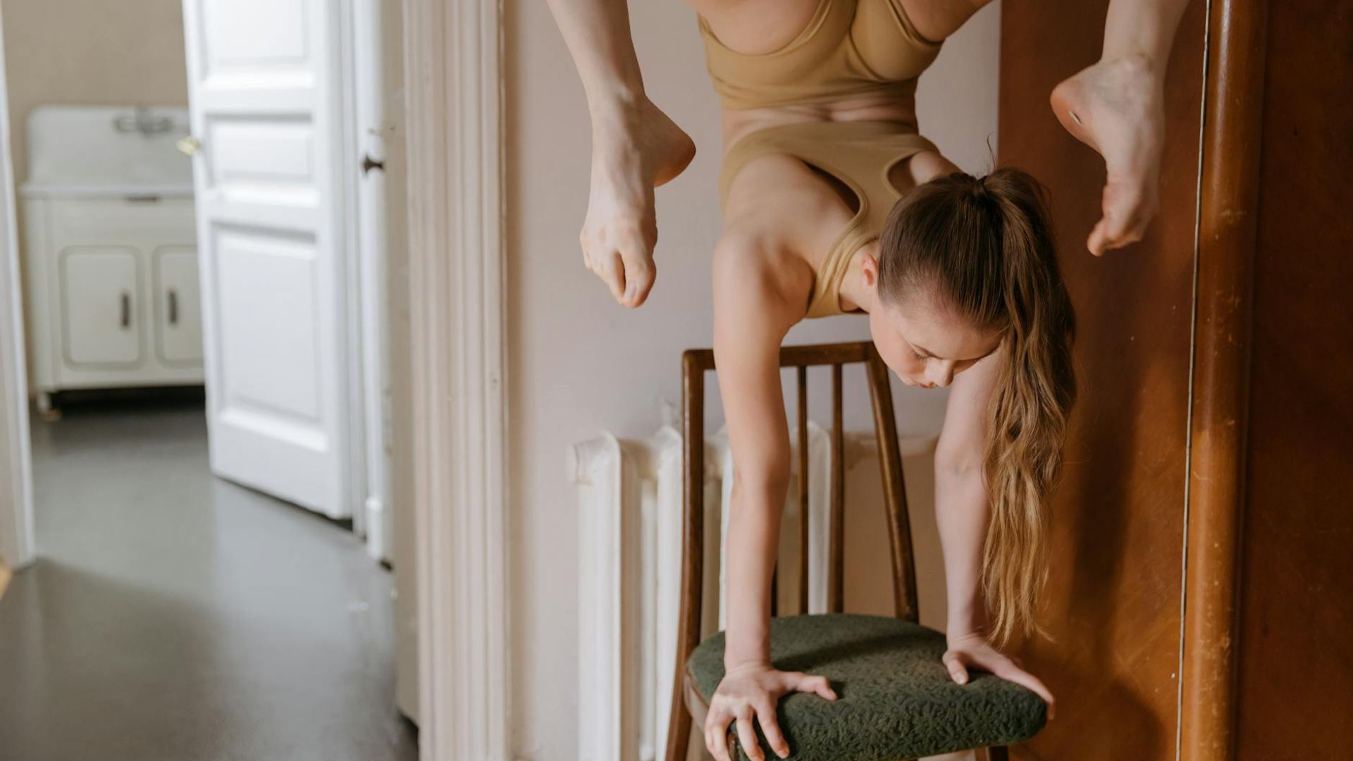 Active woman practicing core stability exercises in a bright room