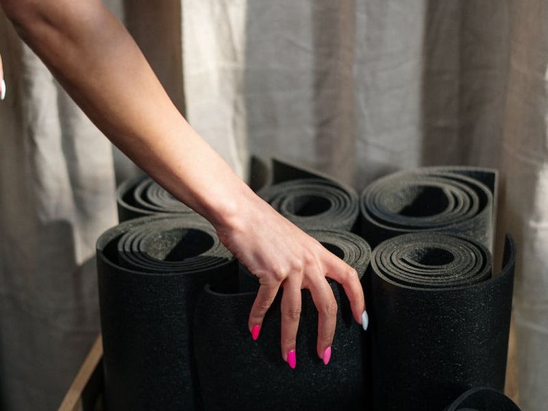 Close up of a fitness mat and equipment in a zen studio